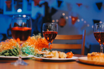 Joyful office Halloween party with coworkers in costumes, celebrating with drinks and laughter,...