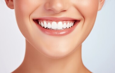 Fototapeta premium Woman smiling, showing clean white teeth and healthy gums. Closeup of a perfect natural smile with glowing skin