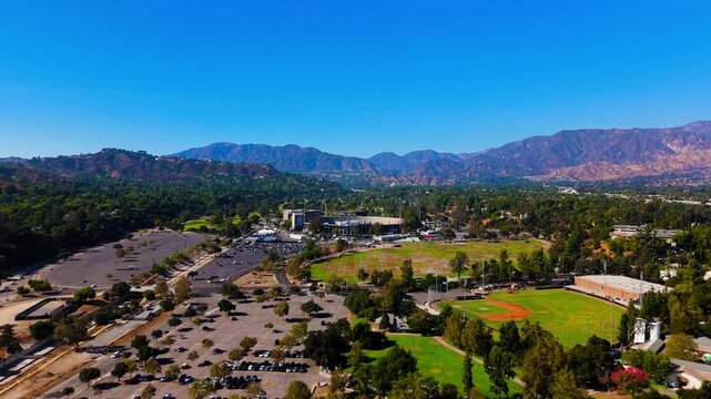 Drone flight forward over Pasadena with Rose Bowl Stadium and San Gabriel Mountains, September 6, 2025