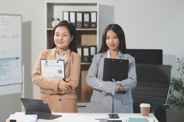 Entrepreneurs and business people conference in modern meeting room, happy multiracial coworkers have fun cooperating working together at office meeting, asian teamwork concept