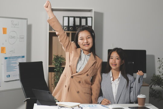 Entrepreneurs and business people conference in modern meeting room, happy multiracial coworkers have fun cooperating working together at office meeting, asian teamwork concept - Powered by Adobe