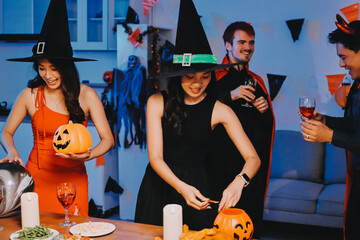 Fototapeta premium Joyful office Halloween party with coworkers in costumes, celebrating with drinks and laughter, fostering teamwork and festive spirit