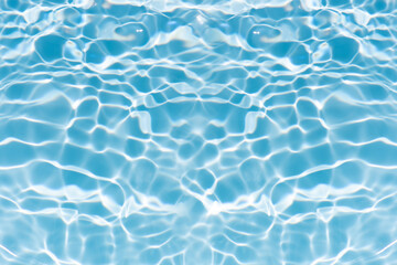 Blue water with ripples on the surface. Defocus blurred transparent blue colored clear calm water...