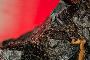 Macro magnetite crystals at 3.7x — black iron mineral with iridescent sheen. Key subject for geology, metallurgy and paleomagnetism