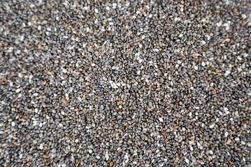 Top view of chia seed texture filling the frame. Ideal for nutrition, clean eating, and vegan diet content.