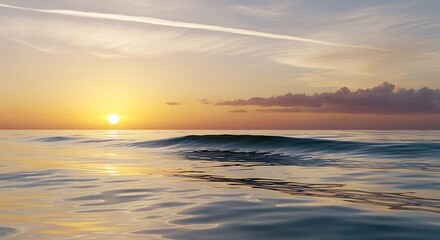 Obraz premium Serene Coastal Sunset: The sun dips below the horizon, painting the sky with warm hues, as gentle waves roll onto the shore. It is a moment of pure serenity and natural beauty.