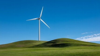 Obraz premium Single white power generator stands tall atop a smooth green rolling hill under a vibrant clear blue sky