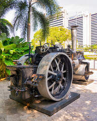 Vintage steamroller historical monument, exhibited in Jalan Parlimen street by Gombak River, Kuala Lumpur, Malaysia