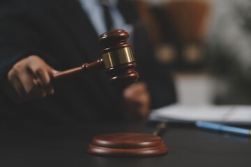 Law theme, mallet of the judge, law enforcement officers, evidence-based cases and documents taken into account.