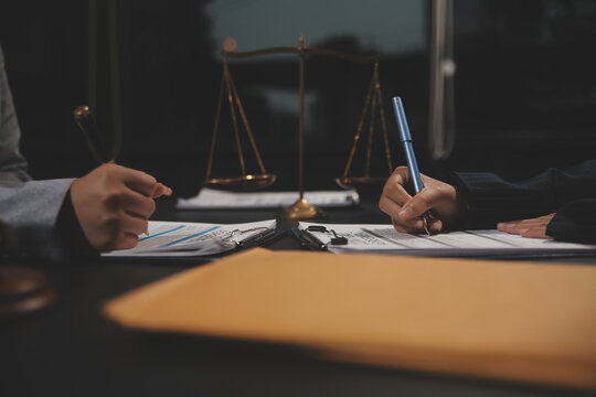 Law theme, mallet of the judge, law enforcement officers, evidence-based cases and documents taken into account.