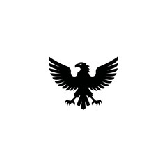 Obraz premium Powerful black eagle silhouette with spread wings, isolated vector graphic on white. Symbol of strength, freedom, victory, and courage.
