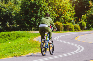 Fototapeta premium Cyclist ride on the bike path in the city Park 