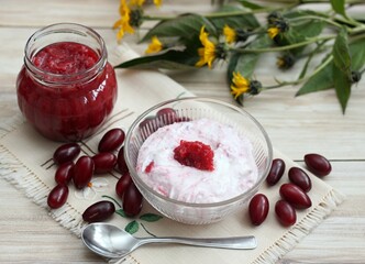 Dessert from cottage cheese and homemade preserved  jam from Cornelian cherry dogwood, lat. Cornus...