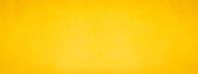 Abstract yellow painted colored scratched paper concrete wall texture background banner panorama