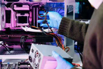 Closeup of technician repairing computer power supply in modern tech lab, symbolizing innovation,...