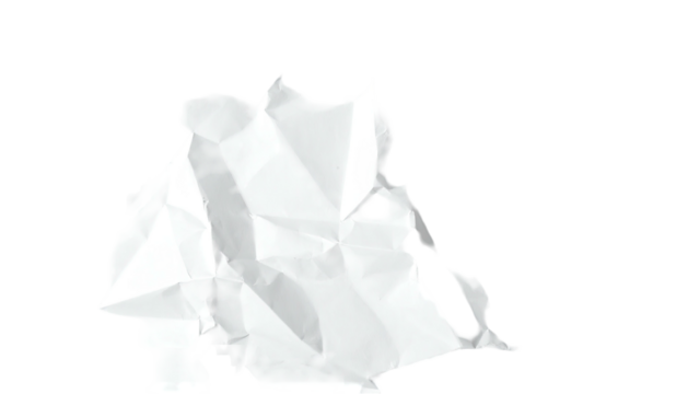 Crumpled white paper ball isolated on a stark black background