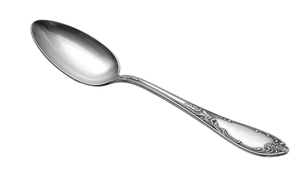Ornate, reflective silver spoon on a dark, gradient background