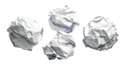 Four crumpled paper balls against a stark black background