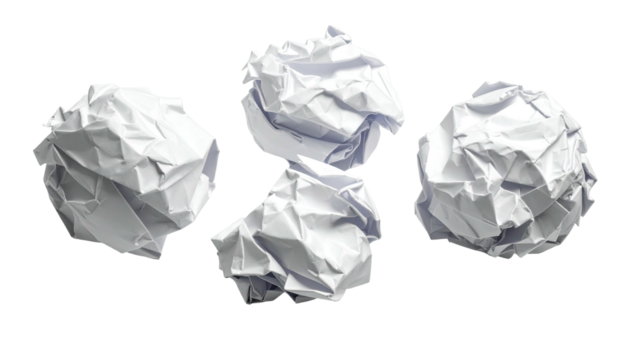 Four crumpled paper balls against a stark black background