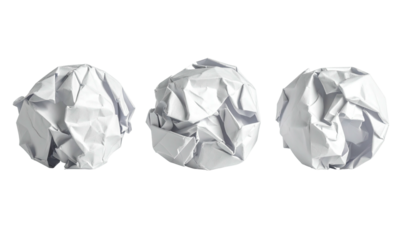 Three crumpled white paper balls on black, studio lighting