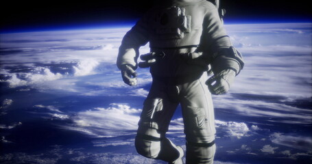 Fototapeta premium An astronaut drifts weightlessly in space, surrounded by the vast blue of Earth and billowing clouds below. The cosmic backdrop enhances the feeling of exploration and tranquility.