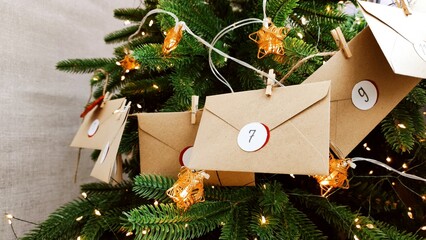 Preparing an Advent calendar for Christmas. Eco-craft envelopes with numbers for children. Christmas background, Advent from small craft envelopes.