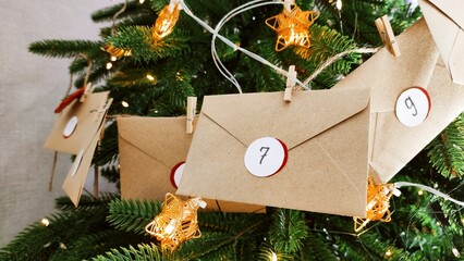 Preparing an Advent calendar for Christmas. Eco-craft envelopes with numbers for children. Christmas background, Advent from small craft envelopes.