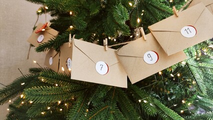 Preparing an Advent calendar for Christmas. Eco-craft envelopes with numbers for children. Christmas background, Advent from small craft envelopes.
