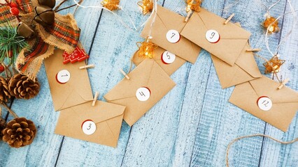 Preparing an Advent calendar for Christmas. Eco-craft envelopes with numbers for children. Christmas background, Advent from small craft envelopes.