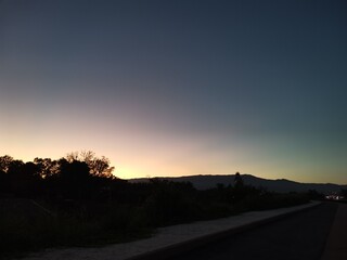 sunset with dark sky on background