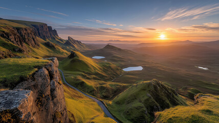 Golden sunrise over a vast mountain range with tranquil lakes below