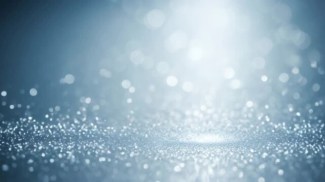 Silver blue abstract bokeh background with frosty light particles and smooth shimmering motion, elegant cinematic glow animation with soft depth and cold luminous texture for luxury design and winter 