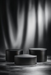 Elegant minimalist black product display podiums against a dramatic textured backdrop for luxury branding and showcasing