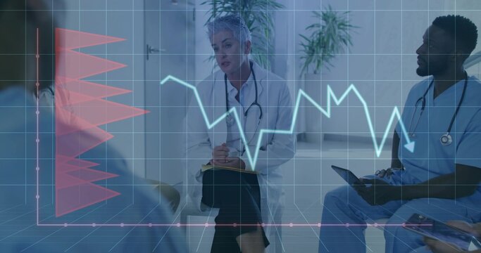 Taking notes senior female doctor using clipboard and pen in consultation room, with digital charts - Powered by Adobe