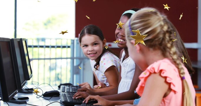 Typing three girls in pastel coral tops at school computer lab with keyboards, with floating stars