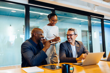 Business professionals sharing ideas and working together in office setting