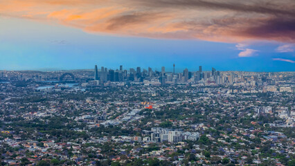 Obraz premium Panorama Sunset aerial drone view of western Sydney Suburbs of Canterbury Burwood Ashfield Marrickville Campsie with Houses roads and parks in Sydney New South Wales NSW Australia