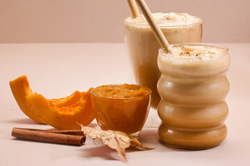 Autumn Pumpkin spice Latte Delight. Pumpkin spice lattes with cinnamon, pumpkin slices, and autumn leaves