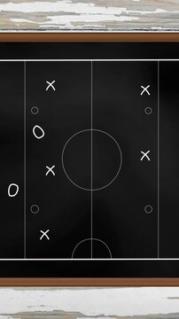 Animation of sports tactics over game pitch on blackboard background