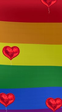 Animation of hearts floating over rainbow flag