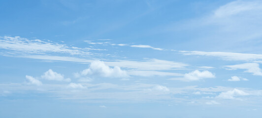 Sky blue background,Summer clear sky, fluffy cloud over beach,Image horizon nature landscape in sunny day with dramatic white cloudy sky on blue gradient color background for spring environment banner