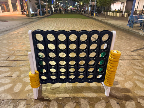 Westwood, California, Connect 4 Giant Outdoor Game, Blue-Green with yellow playing pieces or rings on a public street, Broxton Avenue, Westwood Village, Near UCLA Adult and Children's Activity