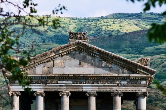 Temple of Garni pediment and columns framed by green hills