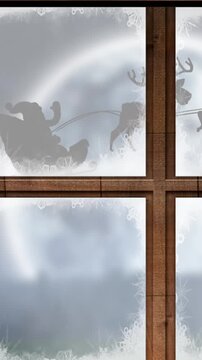 Animated Christmas scene with Santa, reindeer, and tree against the night sky.