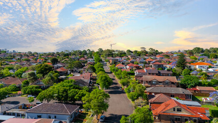 Panorama Sunset  aerial drone view of western Sydney Suburbs of Canterbury Burwood Ashfield Marrickville Campsie with Houses roads and parks in Sydney New South Wales NSW Australia © Elias Bitar