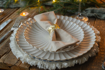 Elegant Christmas table setting. Christmas celebration concept. Table decor for festive dinner.