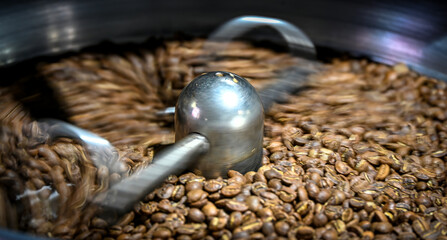 Freshly roasted coffee beans spinning inside a roasting machine