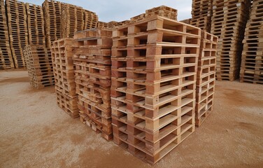 Aerial shot capturing organized pallets stacked in a warehouse at sunset, showcasing the tranquility of logistics operations