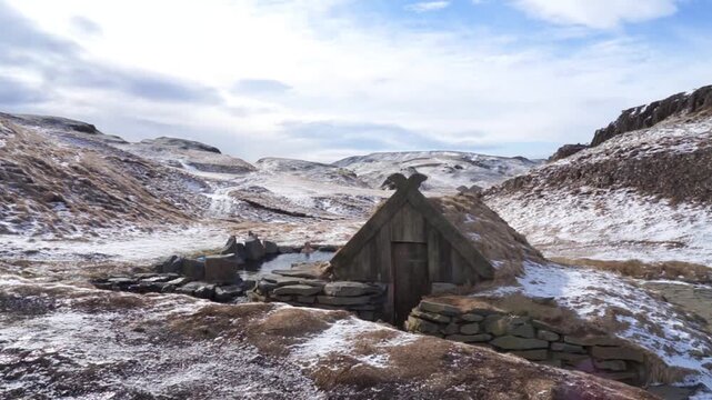 Traditional viking turf house in a snowy icelandic landscape