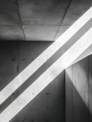 Fototapeta premium Minimalist architectural interior with intersecting diagonal beams of bright sunlight casting sharp geometric shadows on textured concrete walls and ceiling